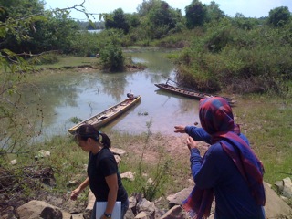 Paw in Sabang villages showing us his boats and the Mun river.